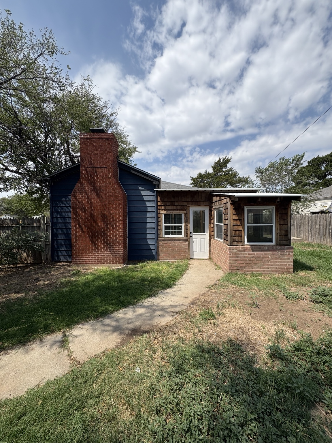 Backyard and rear exterior of 4011 S Tyler St.